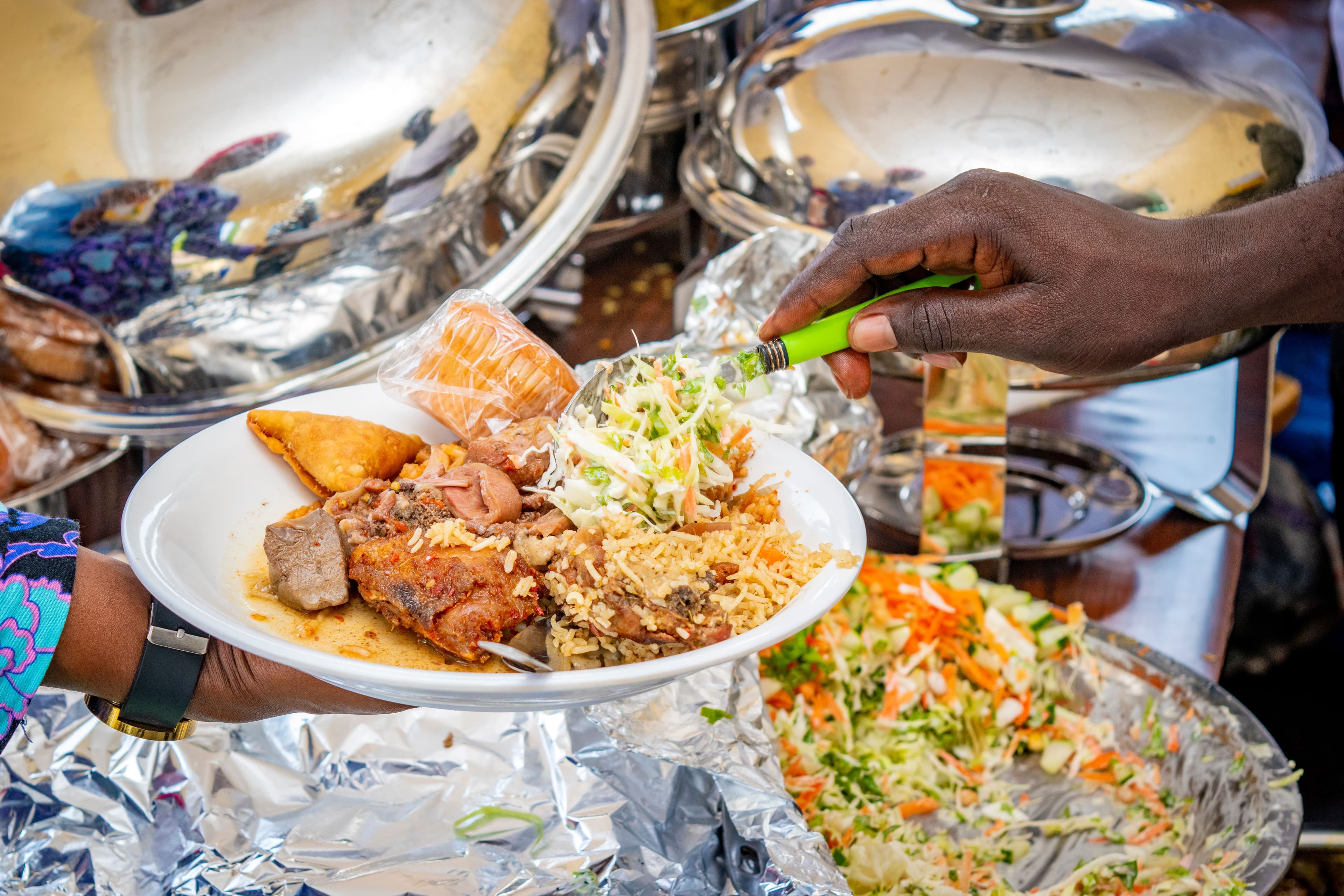 A family enjoying a catered staycation meal at home.